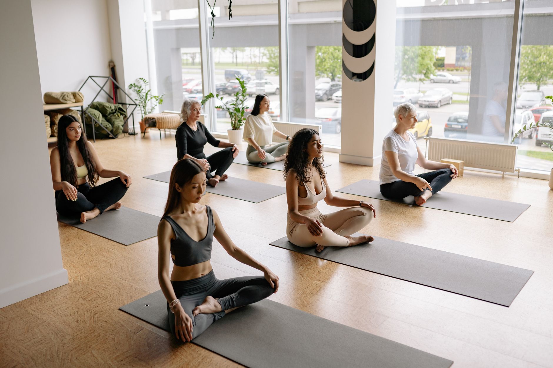Students on mats in a yoga class